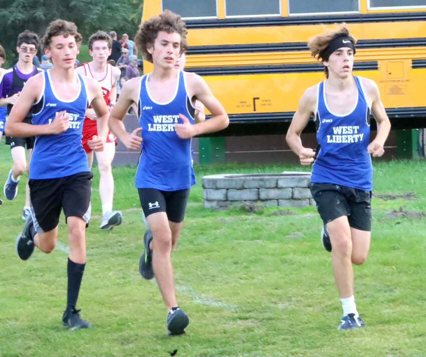 Cameron Elizondo (left), Joaquin Elizondo (middle) and Manu Garcia Blanes (right) ran the first mile of the race side by side at Grace Lutheran Bible Camp in DeWitt.