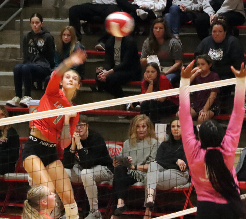Lancer junior Abbey Hayes converts one of her 16 kills against Clinton in the regional semifinals on Thursday.