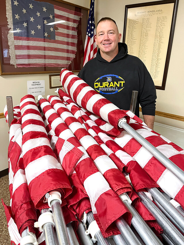 Taking over for his late dad, Kenneth Huesmann, son Kyle now leads the Lt. J.L. Schryer American Legion Post 430 Holiday Home American Flag Display program in Durant, where 468 households have a flag placed in their yard five times a year.&nbsp;&nbsp;&nbsp;&nbsp;&nbsp;&nbsp;&nbsp;