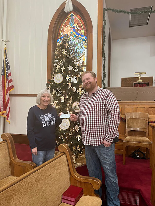 Cindy Tietz, Treasurer of the Wilton Alumni Association, gave a donation of $350 to Pastor Patrick Slessor for the Wilton/Durant Ministerial Association. The money was collected from the free-will donation at the Alumni&rsquo;s Christmas play.