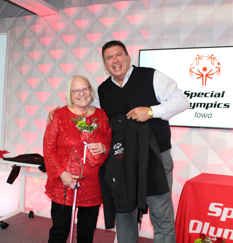 Jane Bergendahl (left) with Special Olympics Iowa President and CEO John Kliegl (right) at the induction ceremony on December 7.