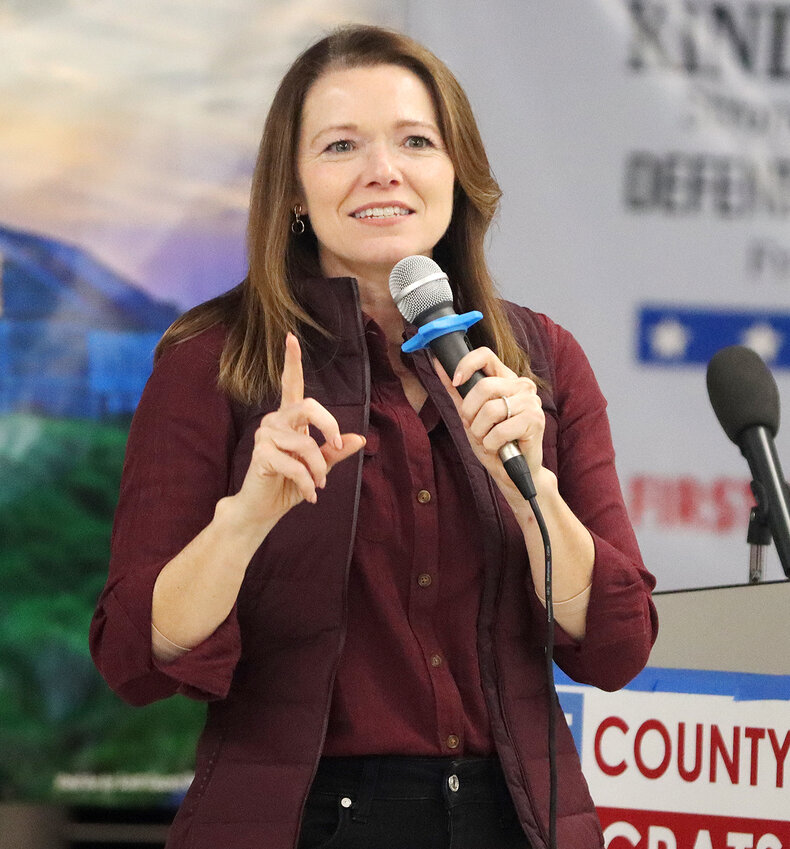 Congressional candidate Christina Bohannan addresses caucus attendees Monday night.