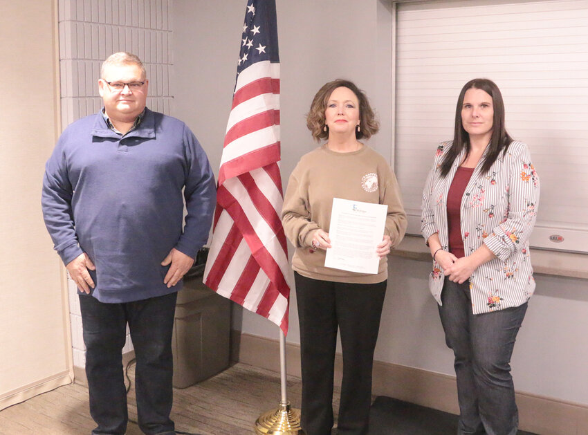 Eldridge Mayor Frank King joins Deanna Valliere, and Family Resources representative Sarah K., Jan. 2 to proclaim January as Slavery and Human Trafficking Prevention Month.