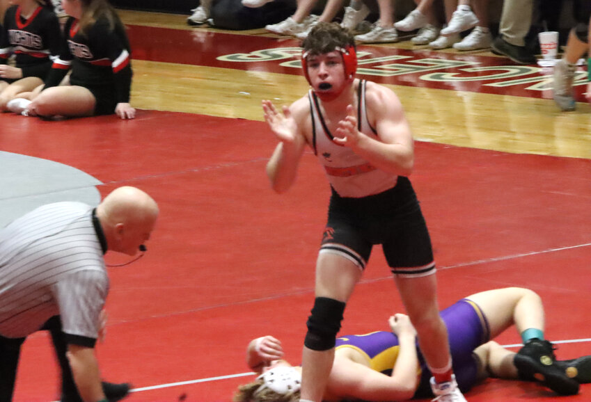 Lancer sophomore Ben Lightle is pumped up after defeating Central DeWitt's Lawrence Flynn in the 157-pound title match.
