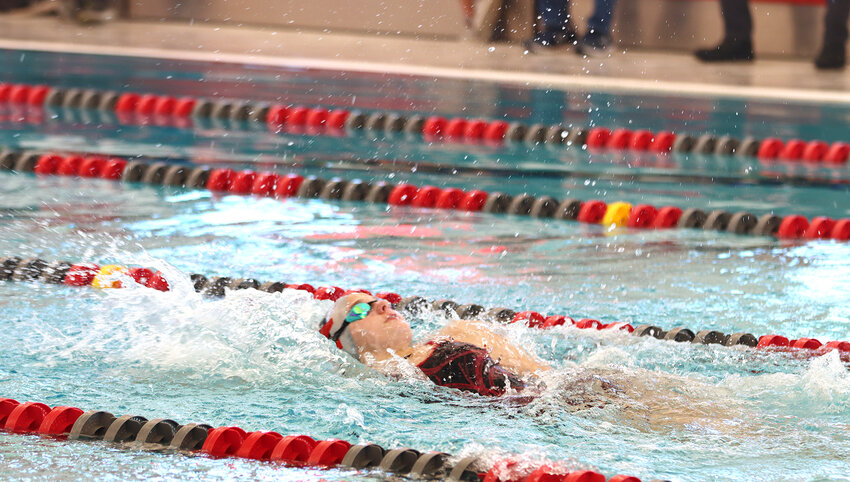 Madyson Sparkman swims her leg of the 200-yard medley relay in the North Scott YMCA pool.