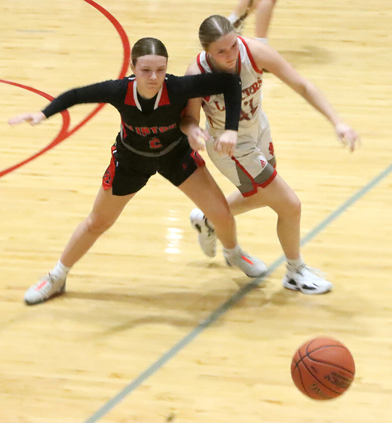 Lancer freshman Alyanna Nelson battles for one of many loose ball opportunities created by North Scott during Friday night's win against Clinton.