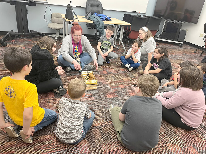 Wilton Public Library Children&rsquo;s Librarian Rebecca Bovenmyer leads a group session as she tests a bridge built with spaghetti noodles.