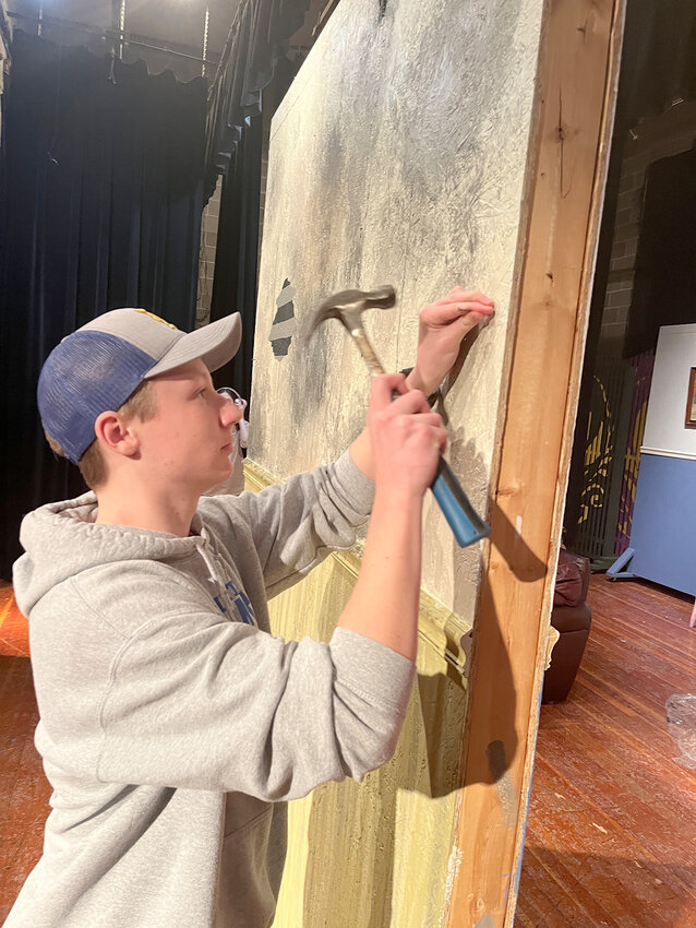 Durant sophomore Royce Richman works on a stage prop Monday in helping prepare for the unveiling of &ldquo;Annie Jr.&rdquo; to be held March 2-3 at Durant High School.
