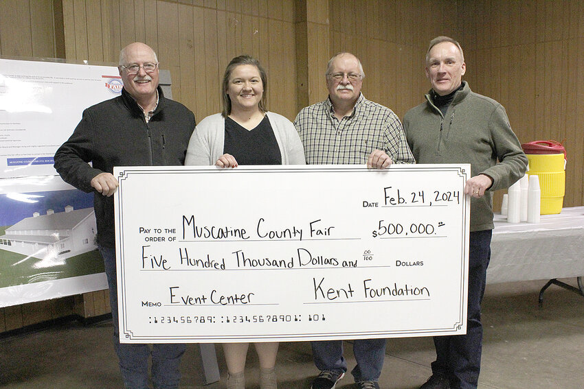 The Kent Corporation has donated $500,000 in matching funds towards the building of a new event center at the Muscatine County Fairgrounds. From left, Fair Board Member Tim Nichols, Muscatine County Fair Manager Kelsey Meyers, Fair Board President Steve Alt, Senior VP of the Kent Corporation Rich Dwyer