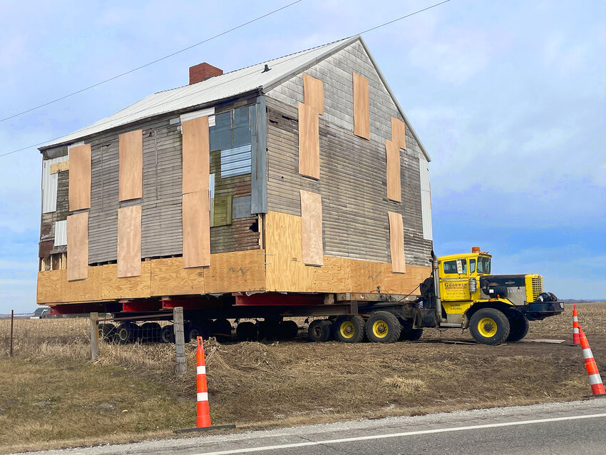 The stagecoach inn was securely attached to the back of an oversized bed pulled by Goodwin House Moving before its big move to West Liberty on Monday, Feb. 26
