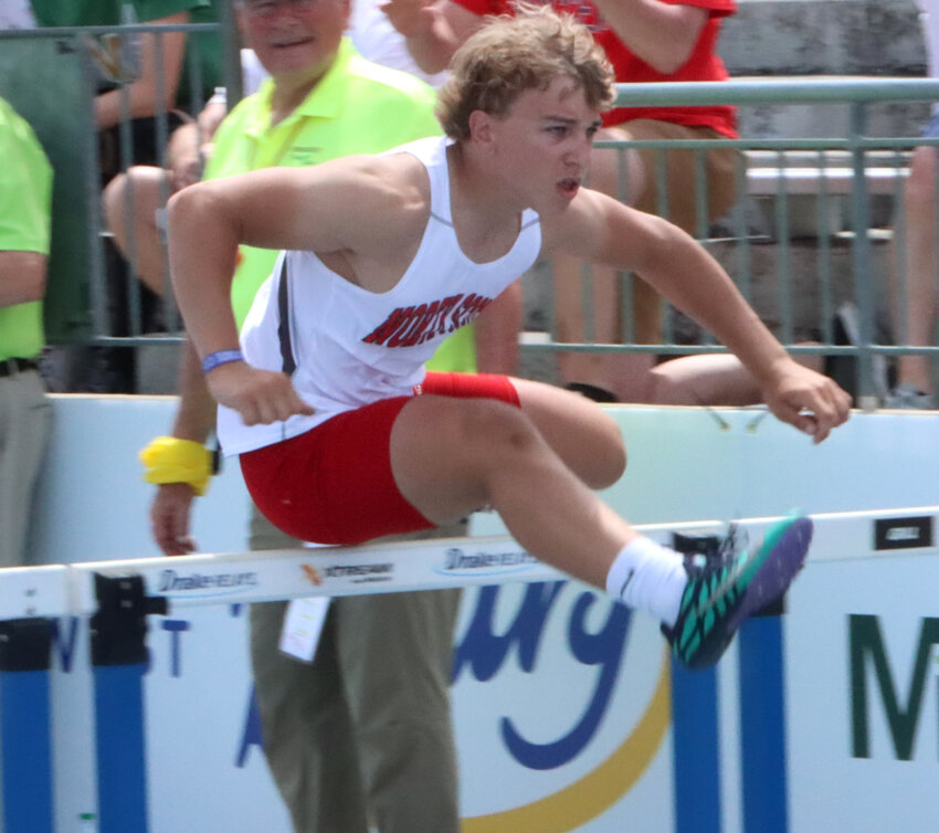 Evan Kruse runs his leg of the hurdle relay at the 2023 state meet.