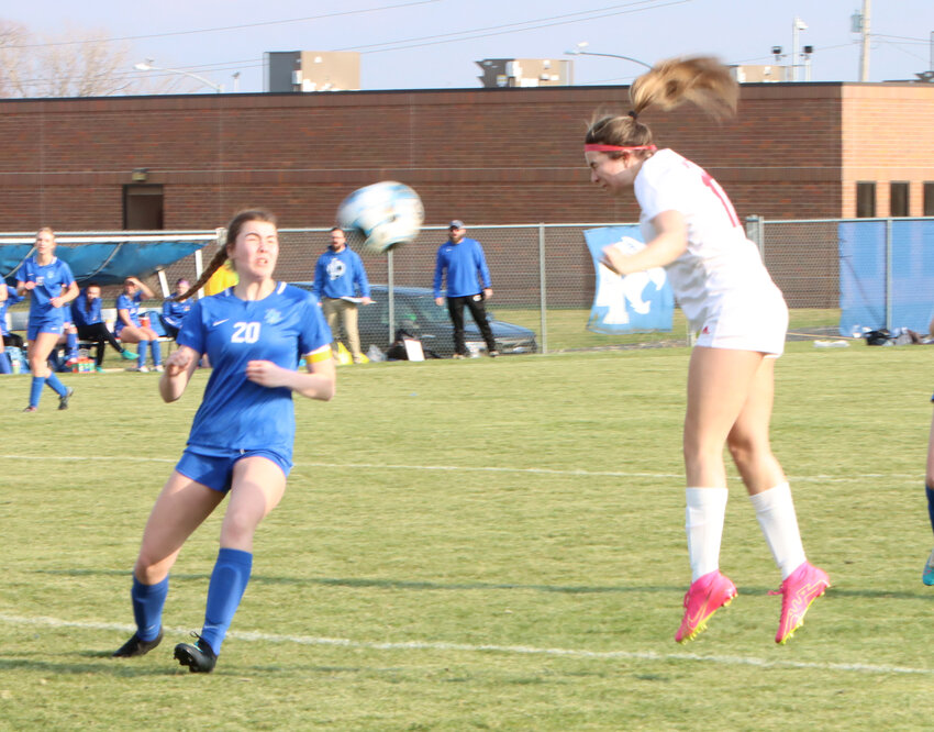 Lancer sophomore Kenzie Moeller puts away the first North Scott goal of the season on this second-half header against Davenport North.