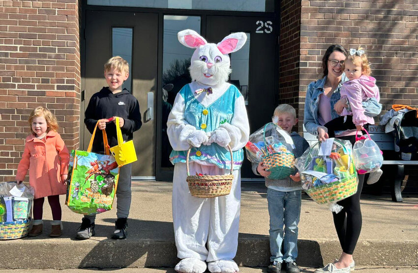 Egg hunters collect Easter prize baskets at the Donahue American Legion Auxiliary hunt Saturday.  Evelyn Nylin, and Remington Donasche won the three and under group. Leom Westerhoff won the kindergarten group; Asher Bakken won first through fourth graders. Baskets were provided by contributions from First Trust and Savings, Ray's Pub and the Rusty Rooster contributed along with the City of Donahue and the Sportsmen's Club.