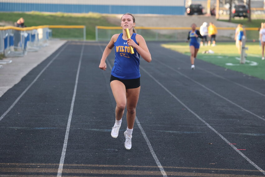 Catie Hook races down the track during a relay