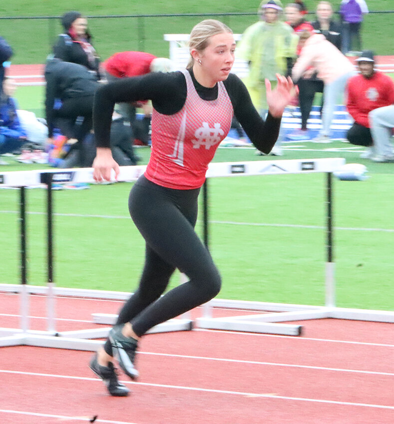 Sophomore Addison Allen books it down the track during the shuttle hurdle relay.