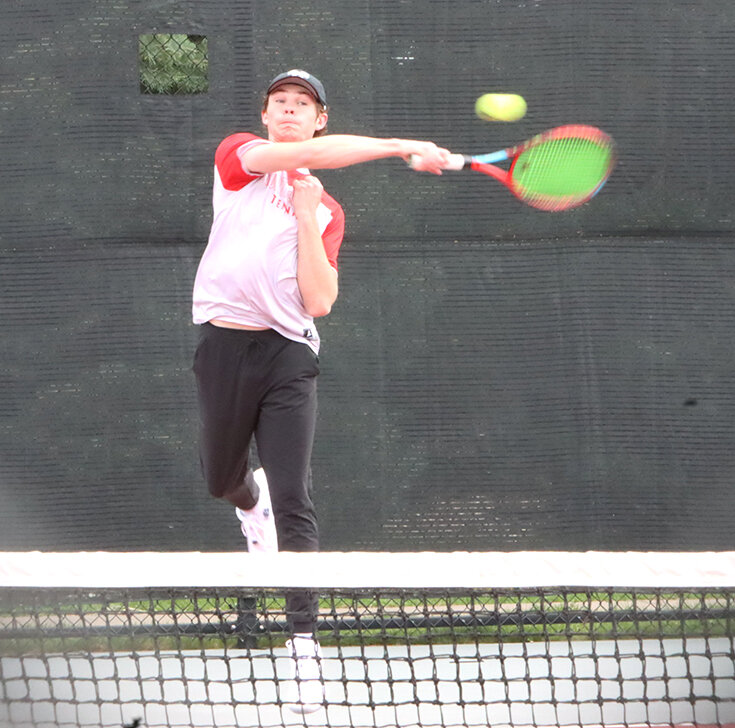 Senior Doyle Lucier whips this forehand across the court during his match against the Wildcats.