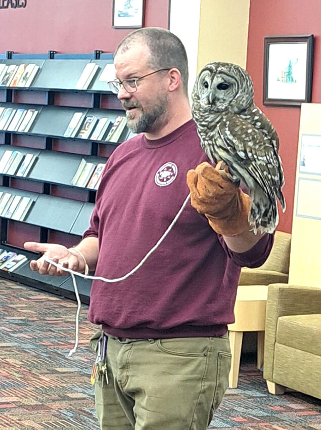 Environmental Learning Center at Discovery Park Naturalist Luke Hart shows off Nadie the Owl on Thursday, April 18, in the Wilton Public Library