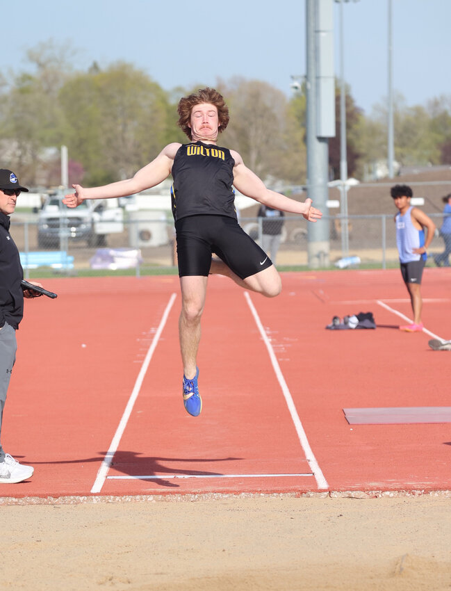 Wilton's Noah Gray jumps for joy during last week's Pacha Relays at Clear Creek-Amana High School.