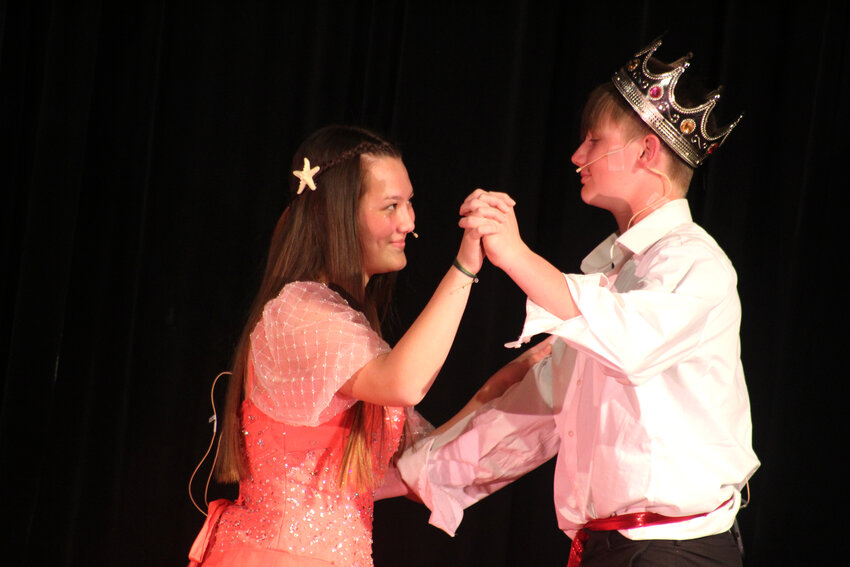 Madison Smyser (Ariel) and Cannon Davis (Prince Eric) share a dance during the Durant Jr. High choir&rsquo;s production of &quot;The Little Mermaid Jr.&quot; on April 17 and 21 in the Durant High School auditorium