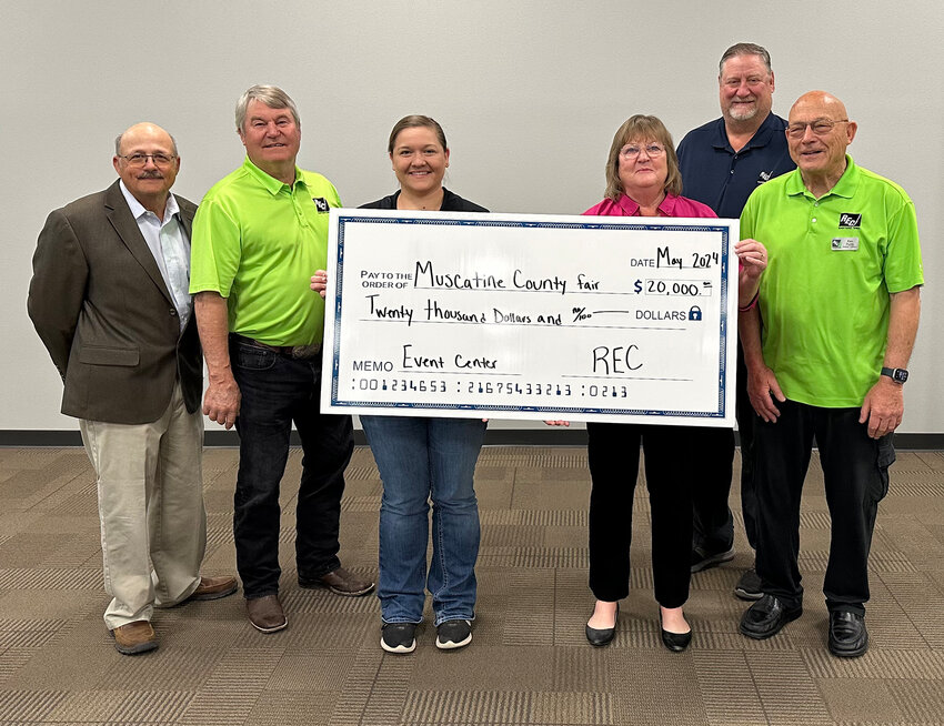 From left are Allan Duffe, Cooperative Director; Bill Petersen, Cooperative Director; Kelsey Meyers, Muscatine County Fair Manager; Kathy Wunderlich, Cooperative Board President; Kirk Trede, Cooperative CEO; and Ken Purdy, Cooperative Board Vice President