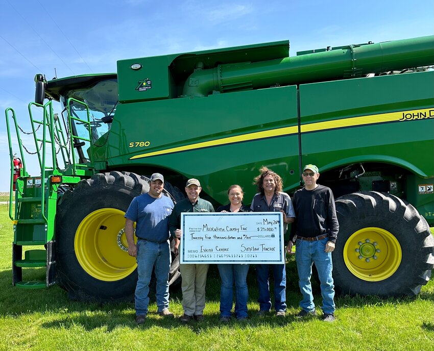 From left to right- Donovan Yoder (Fair Board), Bob Sinclair (owner of Sinclair Tractor), Kelsey Meyers (Fair Manager), Tom Christensen (Fair Board), Larry Salemink (Fair Board)