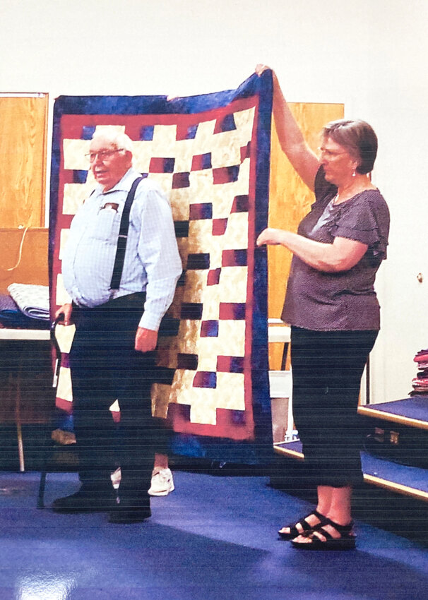 Jack accepts a quilt of valor, May 19, at the Davenport Masonic Center.