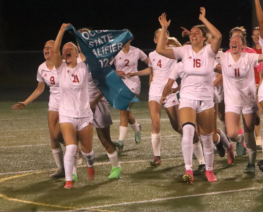 The North Scott girls' soccer team didn't hold back their excitement as they rushed toward the stands to share the moment with friends and family.