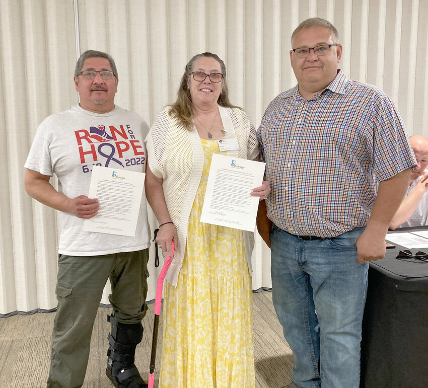 Mayor Frank King presents a proclamation to LaNae and George Ramos, recognizing June 28 as Community is Stronger than Cancer Day in Eldridge. The day honors cancer support for programs that served 264,057 adults and 25,950 children last year in Iowa, the state with the nation&rsquo;s second highest, and fastest growing cancer rates, the mayor said.