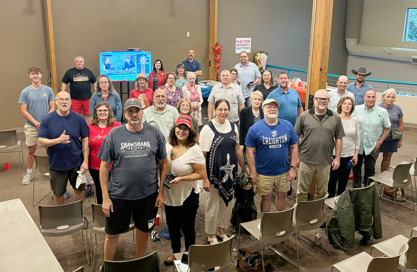 Scott County Republicans represent Thursday at their watch party in the new headquarters at Davenport&rsquo;s Paul Revere Square. The crowd included county chair Jeanita McNulty, North Scott school board member Carrie Keppy, and former state Sen. Maggie Tinsman.