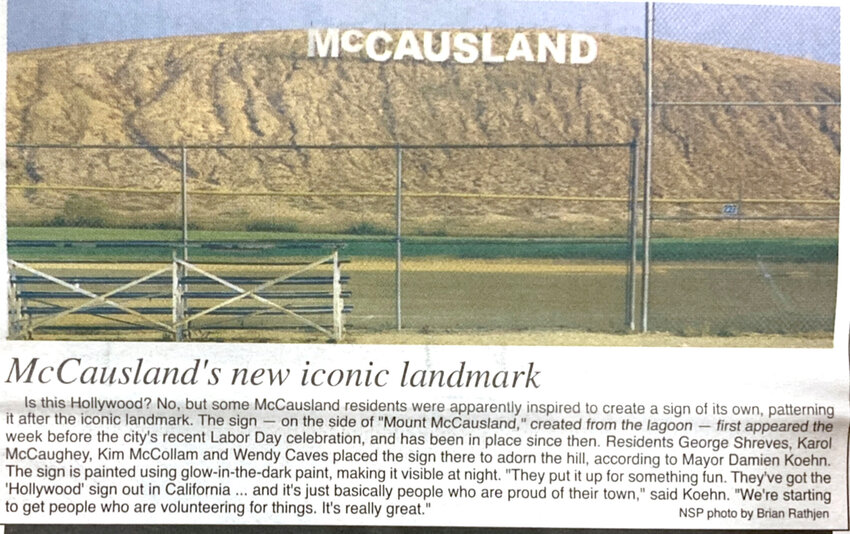 2009: McCausland residents George Shreves, Karol McCaughey, Kim McCollam and Wendy Caves erected the iconic sign atop a sand mountain. The sign remains, but the town leveled the mountain in 2016.