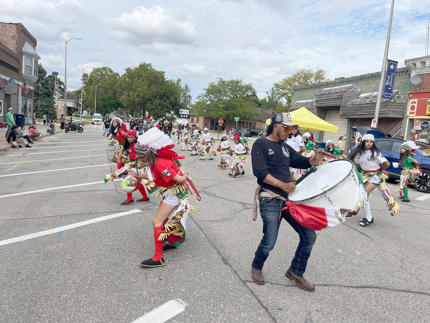 Members of the Danzas Y Ballett Folkloricus start their march in the Fiesta Latina parade Saturday afternoon.   Index photos by Tim Evans