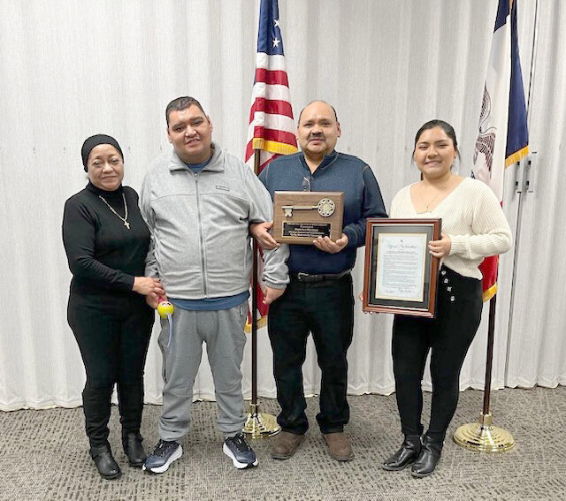 Francisco Javier Martinez Sixtos accepts a key to the City of West Liberty for his countless years of service and dedication to our community. Francisco was presented the award during the Dec. 17  City Council meeting.  Mayor Mark Smith wrote a proclamation and gave Francisco Martinez the Keys to the City in recognition of all the years of work he does with the Fiesta Latina. From left, Martinez&rsquo; wife Maria, their son Paco, Francisco and daughter Luz.  Contributed photo