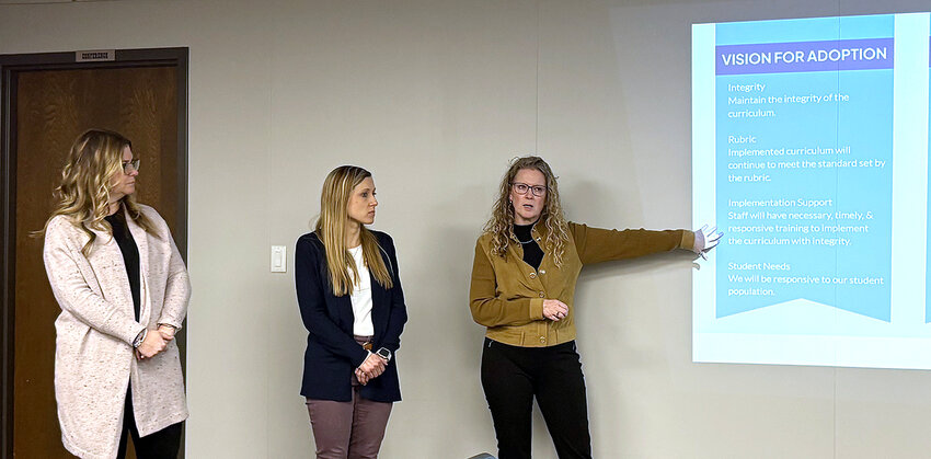 Teachers Robyn Leiby and Joanna Johnson and curriculum director Nicole Litterer discuss new math resources.