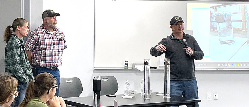 J.D. Hollingsworth, right, presents at the Soil Health and Cover Crop meeting. Also pictured are Scott NRCS District Conservationist Kristen Fenderson and Jason Steele.