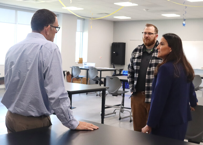 Iowa Lt. Gov. Chris Cournoyer talks with superintendent Joe Stutting and ag teacher Jacob Hunter in a vet tech classroom at the Regional Innovation Center.