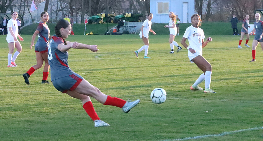 Freshman Reese Barnett crosses in a shot against Bettendorf on Tuesday, April 8.