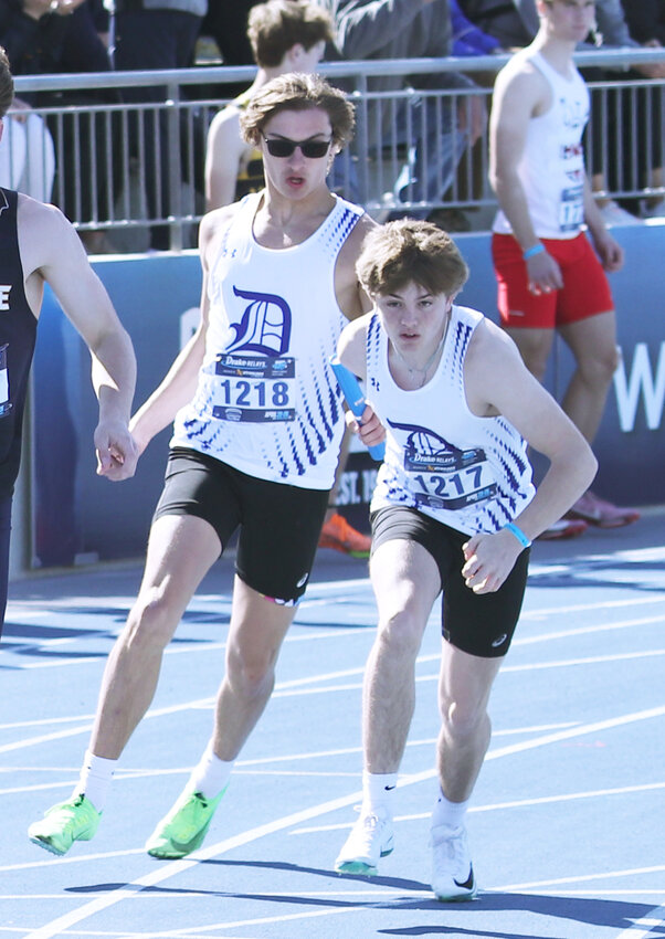 Durant's Connor Schwarz passes the baton to Brady Mizer.