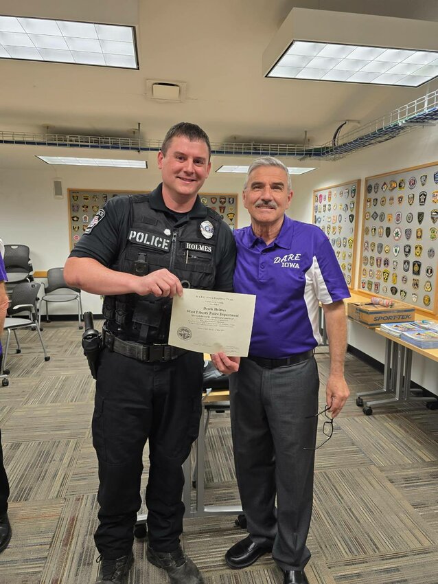 West Liberty Officer Derek Holmes receives his D.A.R.E. certification.
