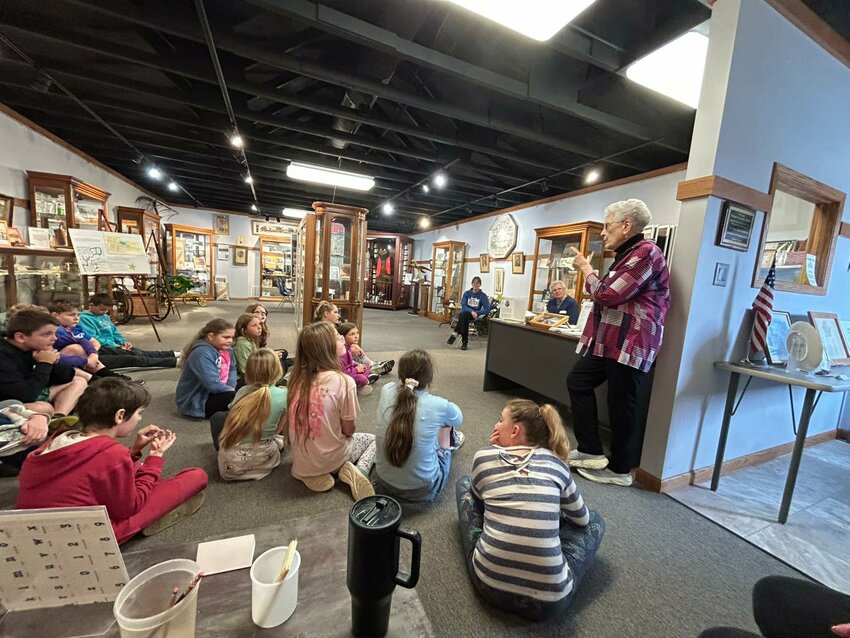 Durant 4th graders enjoy hearing about their town's history from the Tri-County Heritage &amp; Genealogy Museum.