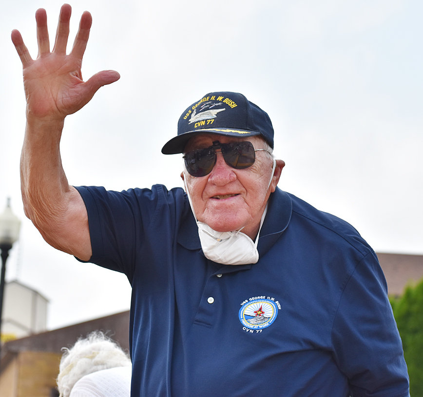 Former Wilton United Methodist Church Pastor Paul Pennington is shown waving to the crowd at the Muscatine County Freedom Rock dedication Sept. 6. He traveled back to Wilton with his wife Sharon to view the ceremony, where their son Will Pennington was a guest speaker.