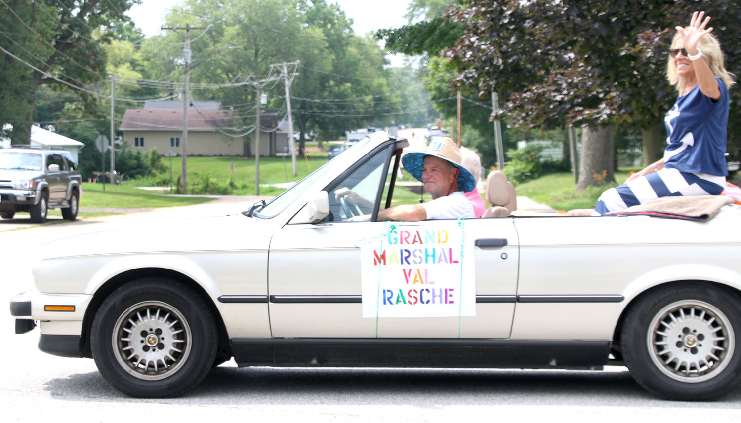 Grand Marshal Val Rasche waves to the crowd.