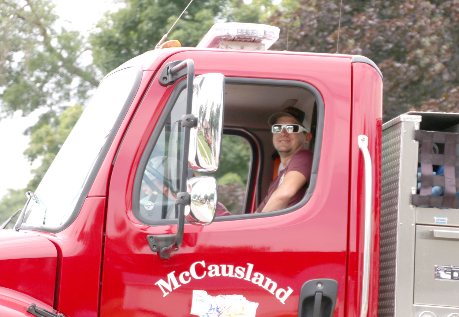 McCausland Fire Chief Tony Dipple, accompanies the fire trucks in the parade.