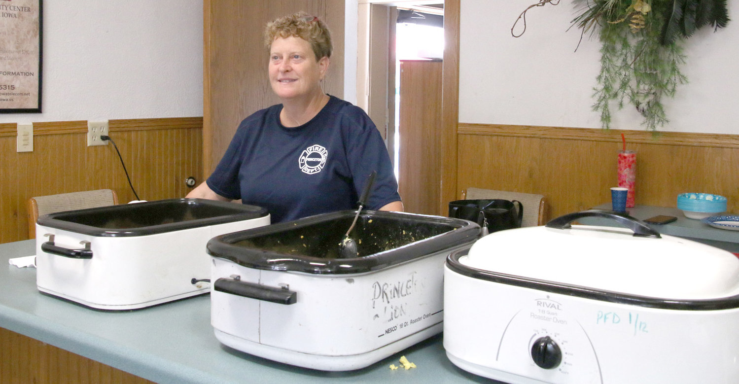 Gina Wolfe serves food for the fireman's breakfast in Princeton's Community Center.