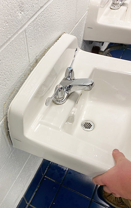 Vandals pulled sinks from the walls, resulting in water pipes leaking underneath.
