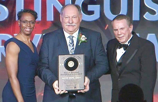 Dave Huff, middle, receives the NIAAA’s Bruce D. Whitehead Distinguished Service Award from NIAAA President Dr. Lisa Langston, left, and Executive Director Dr. Mike Blackburn, right.