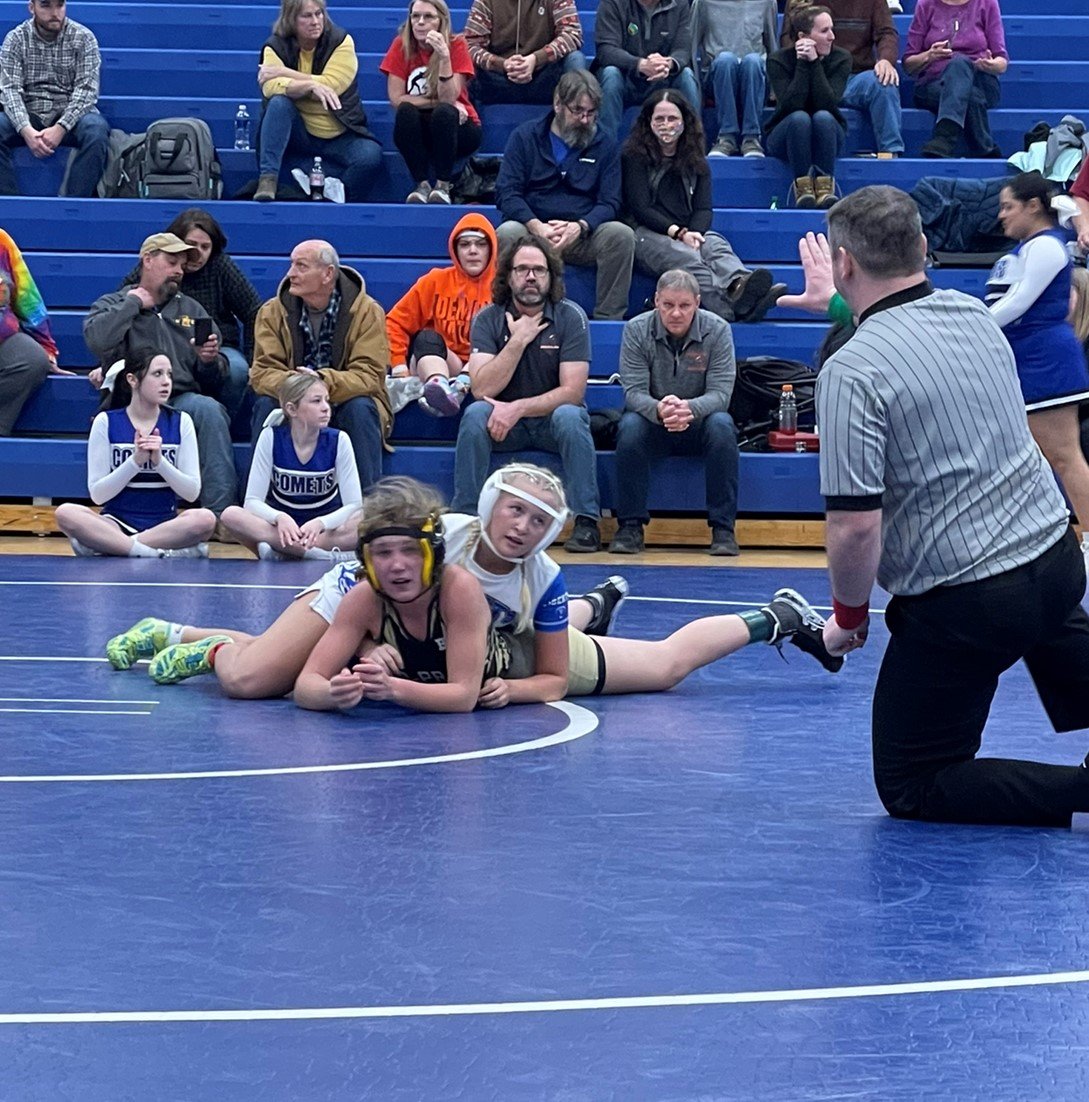 McKinzie Akers battles for West Liberty on the wrestling mats.