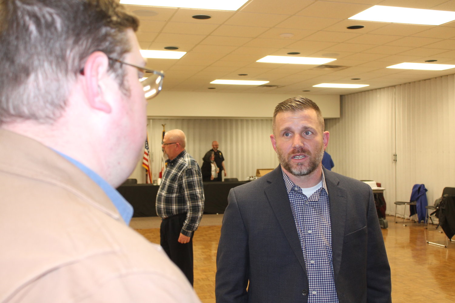 Brandon Achen (right) is the new President & Chief Executive Officer effective May 31 for West Liberty Foods. He is speaking with WeLead Executive Director Ken Brooks  after a West Liberty City Council meeting at the beginning of May.
