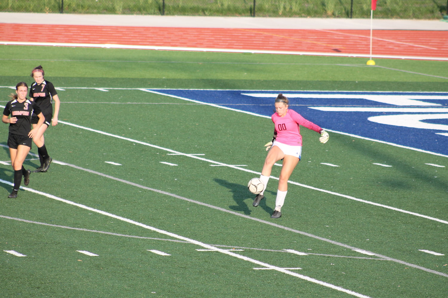Goalie Crystal Ledezma kicks the ball away during the game.