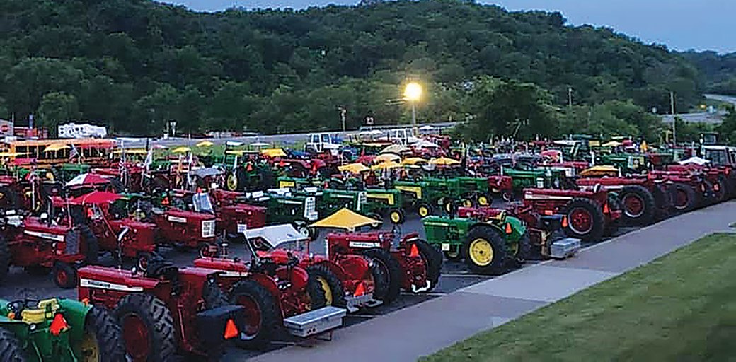 A scene from a past Tractorcade shows the many machines participating.  This year's event is expected to draw about 500 tractors and their owners and families to the Muscatine County Fairgrounds beginning this Sunday for the three-day event.