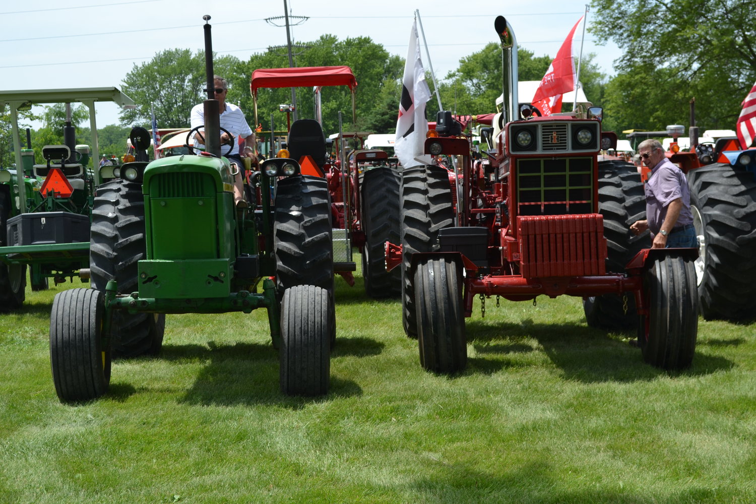 A first for West Liberty, tractor drivers parking their tractors at the Muscatine County Fairgrounds Sunday evening.  Pearticipants came from as far as Michigan to participate in this year's Tractorcade despite temperatures being in the upper 90s.